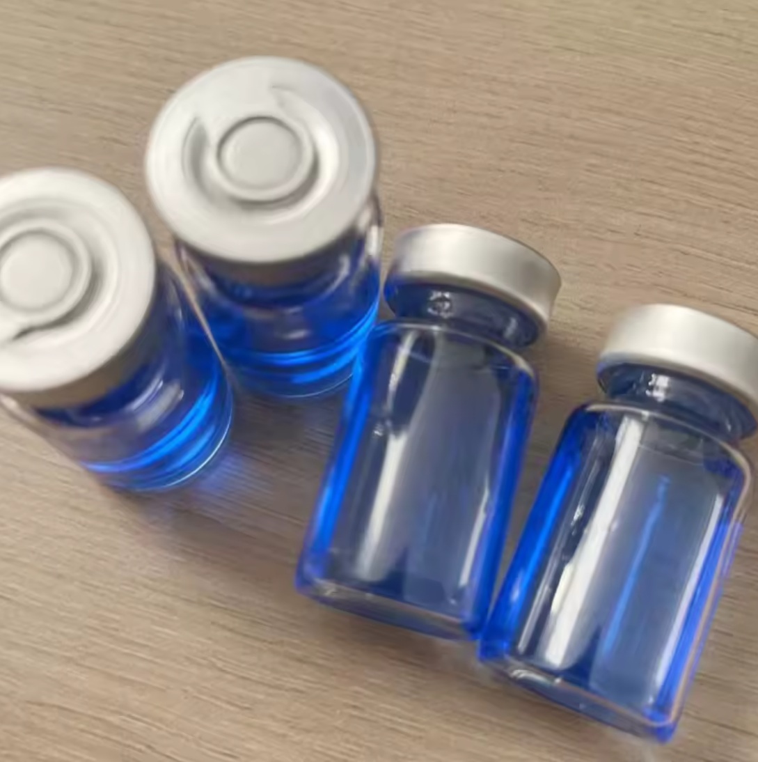 Plain unlabeled clear glass lyophilized vial with blue cap